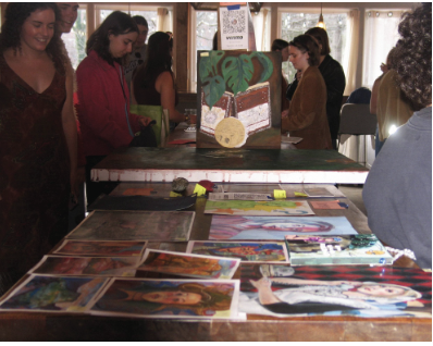 Students browse through artwork in Summit Coffee Outpost. Photo by Courtney Lassiter ‘27 and Tehinnah Kitcher ‘27.