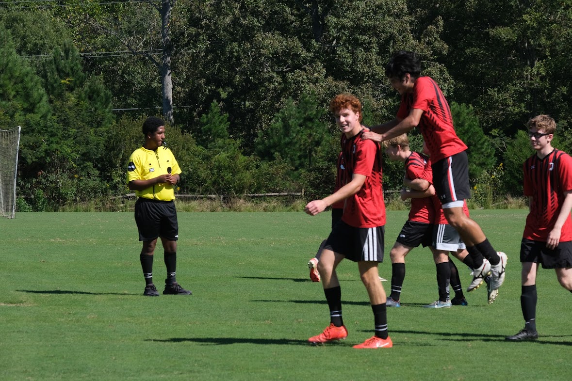Men’s club soccer captain Dominick Shraeder ’26 celebrates with Fin 
Spitaleri ’28. Photo by Clyde Dwyer ’25.