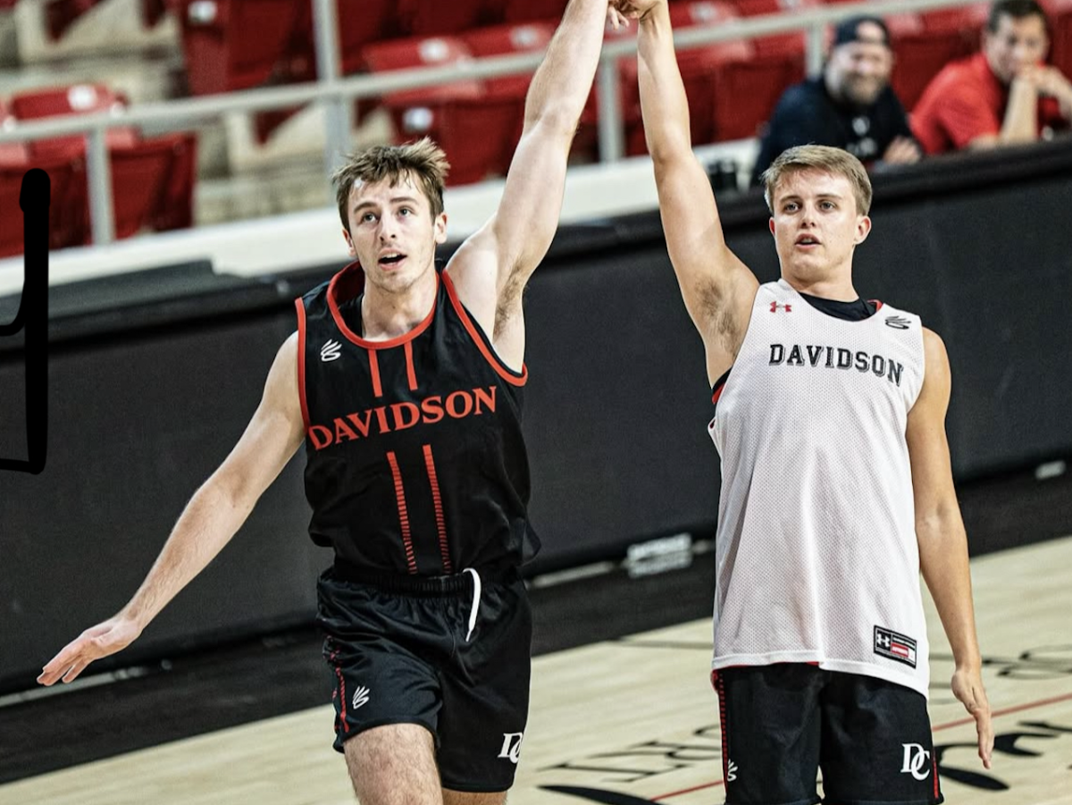 Brock Matheny '26 and Sam Brown '27 at a practice scrimmage. Photo courtesy of @davidsonbasketball on Instagram.