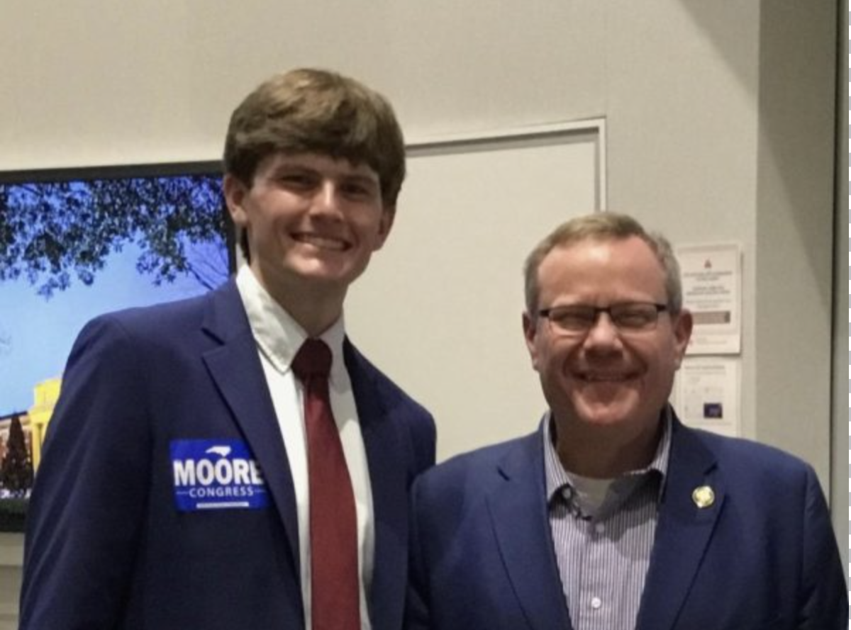 Oliver Genovese ‘28 (left) stands with Representative Tim Moore (R-NC-14). Photo courtesy of Oliver Genovese.