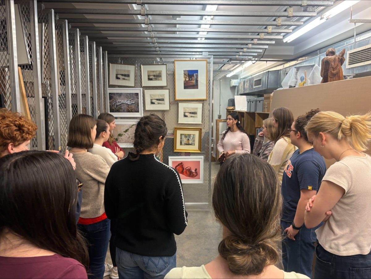 Students tour work collections from VAC basement storage. 