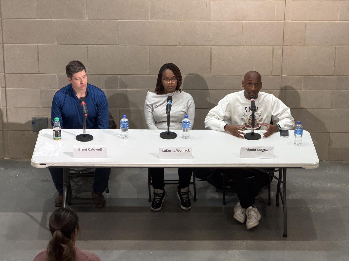 Democratic candidates Brent Caldwell, Lakesha Womack and Ahmid Kargbo speak at a panel event.